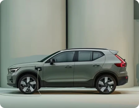 Electric SUV charging on a studio background